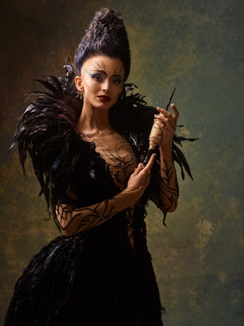 Katherine Sonnekus as Carabosse in "The Sleeping Beauty," holding a spindle.